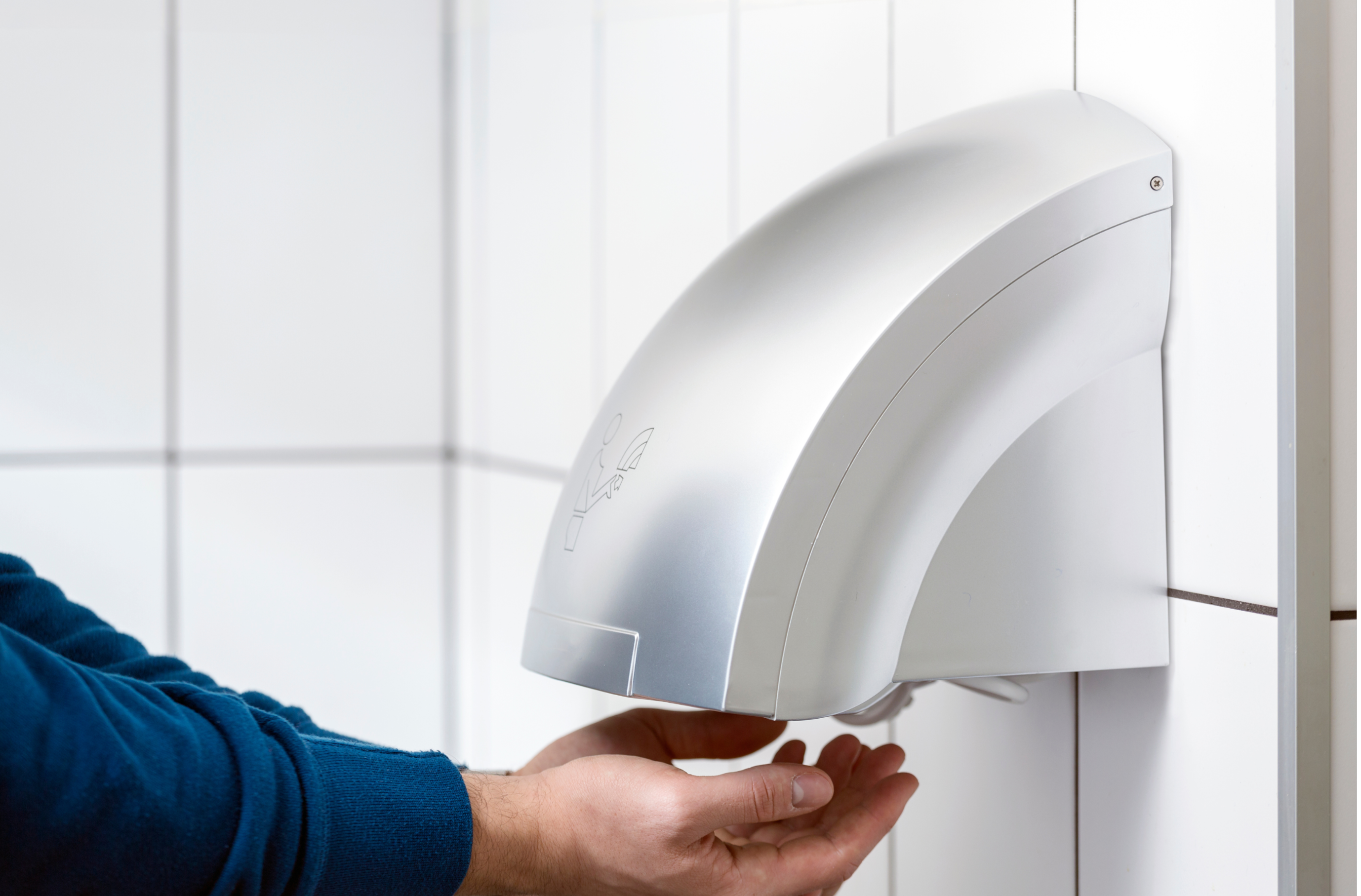 Hand dryer in a washroom