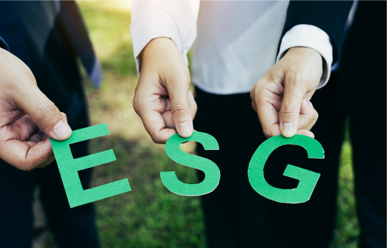 Hands holding letters spelling ESG